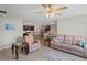 Open-concept living room connected to the kitchen, featuring comfortable seating and a bright atmosphere at 8508 Bay Dr, Spring Hill, FL 34606