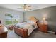 Bedroom with a large window allowing natural light and an overhead fan at 8508 Bay Dr, Spring Hill, FL 34606