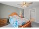 Bedroom features a ceiling fan and a bathroom with a stand-up shower at 8508 Bay Dr, Spring Hill, FL 34606