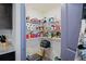 Walk-in pantry with abundant shelving providing lots of storage at 8508 Bay Dr, Spring Hill, FL 34606