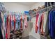 Organized walk-in closet with clothing racks and shoe storage offering functional wardrobe solutions at 8508 Bay Dr, Spring Hill, FL 34606