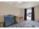 Bright Bedroom with a crib and dresser bathed in natural light from the window at 8708 Albion Ct, Tampa, FL 33634