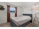 Cozy bedroom with a queen bed and animal decor wall at 8708 Albion Ct, Tampa, FL 33634