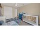 Comfortable Bedroom with natural light, a crib, and plenty of storage at 8708 Albion Ct, Tampa, FL 33634