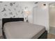 Cozy bedroom with a queen bed and animal decor wall at 8708 Albion Ct, Tampa, FL 33634