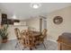 Cozy dining area featuring a wooden round table and chairs, situated adjacent to the kitchen area, providing a functional layout at 8708 Albion Ct, Tampa, FL 33634