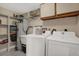 Laundry room featuring new appliances and a large sink at 8708 Albion Ct, Tampa, FL 33634