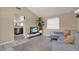 Inviting living room with tile floors, complemented by a sectional sofa and lots of light from the large window at 8708 Albion Ct, Tampa, FL 33634