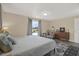 Bright main bedroom with a large window, neutral walls, and a comfortable bed at 8708 Albion Ct, Tampa, FL 33634