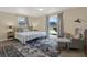 Comfortable bedroom featuring a queen-size bed, soft carpet, and ample natural light, creating a relaxing retreat at 8708 Albion Ct, Tampa, FL 33634