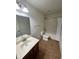 Full bathroom with vanity, mirror, toilet, and shower over tub with curtain at 9126 Lantern Oak Way, Land O Lakes, FL 34638
