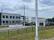 Exterior view of Dayspring Angeline Academy featuring modern architecture and ample parking at 9126 Lantern Oak Way, Land O Lakes, FL 34638