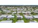 Neighborhood shot from above, showing neat landscaping, similar homes, and brick driveways at 9226 41St N St, Pinellas Park, FL 33782