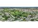 Community aerial view showcasing homes, a golf course, and nearby lakes at 9226 41St N St, Pinellas Park, FL 33782