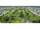 Aerial view of community golf course surrounded by residences and lush landscaping at 9226 41St N St, Pinellas Park, FL 33782