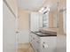 Bathroom with shower, granite countertops, and cabinet storage at 9226 41St N St, Pinellas Park, FL 33782
