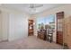 Well-lit bedroom featuring a window view, built-in storage, and ceiling fan at 9226 41St N St, Pinellas Park, FL 33782