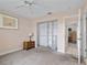 Cozy bedroom with carpeted floors and built-in closet shelving at 9226 41St N St, Pinellas Park, FL 33782