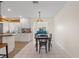 Bright dining area with tile flooring, chandelier, and easy access to the kitchen and living spaces at 9226 41St N St, Pinellas Park, FL 33782