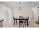 Spacious dining area with tile floors, decorative lighting, and seamless transition to the kitchen at 9226 41St N St, Pinellas Park, FL 33782