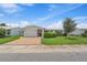 Charming single-story home with well-manicured lawn, brick driveway, and attached one car garage at 9226 41St N St, Pinellas Park, FL 33782