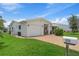 Charming home boasts an inviting front yard with well-manicured lawn and brick driveway at 9226 41St N St, Pinellas Park, FL 33782