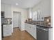 Bright kitchen offers stone backsplash, stainless steel dishwasher, and plenty of cabinet space at 9226 41St N St, Pinellas Park, FL 33782
