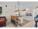 Modern kitchen featuring white cabinets, stainless steel appliances, and bar seating at 9226 41St N St, Pinellas Park, FL 33782