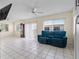 Bright living room with ceiling fan, tiled floors, and open floor plan at 9226 41St N St, Pinellas Park, FL 33782