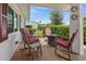 Relaxing covered outdoor patio with comfortable seating and fire pit for entertaining at 9226 41St N St, Pinellas Park, FL 33782