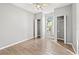 Bedroom with tile floors, ceiling fan, closet space, and window view to exterior at 9416 Lake Chase Island Way # 9416, Tampa, FL 33626