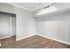 Empty room with hardwood flooring, modern lighting, and neutral paint at 9416 Lake Chase Island Way # 9416, Tampa, FL 33626