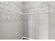 Walk-in closet with metal shelving for maximum storage at 9416 Lake Chase Island Way # 9416, Tampa, FL 33626