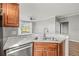 Corner view of bright kitchen featuring stainless steel appliances and open view to living area at 9416 Lake Chase Island Way # 9416, Tampa, FL 33626