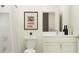 Bright bathroom featuring a shower and vanity, complemented by stylish decor at 9486 Gladsome Dr, Land O Lakes, FL 34637