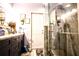 Bathroom featuring sleek vanity with framed mirror and a glass enclosed shower at 11411 N 19Th St, Tampa, FL 33612