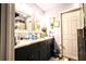 Bathroom features a double sink vanity, a neutral color palette, and a glass-enclosed shower at 11411 N 19Th St, Tampa, FL 33612