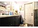 Bathroom features a double sink vanity with grey cabinets, neutral countertops and decor at 11411 N 19Th St, Tampa, FL 33612