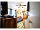 Nicely decorated bedroom with a fan, toys, and colorful ABC rug at 11411 N 19Th St, Tampa, FL 33612