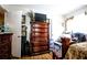 Bedroom showcasing a dresser, wood floors, and ample natural light for a bright and airy feel at 11411 N 19Th St, Tampa, FL 33612