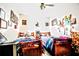 Bright bedroom featuring two beds, personal touches, and ample natural light at 11411 N 19Th St, Tampa, FL 33612