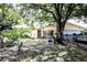 Charming home with a manicured front yard, mature trees, and a two-car garage at 11411 N 19Th St, Tampa, FL 33612