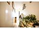 Hallway featuring neutral tones, tile floors, decor, and several doors and openings at 11411 N 19Th St, Tampa, FL 33612
