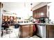 Open-concept kitchen with granite counters, stainless steel appliances, and an adjacent living room for easy entertaining at 11411 N 19Th St, Tampa, FL 33612