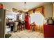 Eat-in kitchen featuring a breakfast bar, bright natural light from window, and pendant lighting, and tiled flooring at 11411 N 19Th St, Tampa, FL 33612