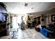 Expansive living area featuring tile flooring and an open layout to the kitchen at 11411 N 19Th St, Tampa, FL 33612