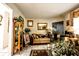 Charming living room featuring tile floors, neutral tones, comfortable seating, and decor at 11411 N 19Th St, Tampa, FL 33612