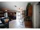 Inviting living room featuring tile flooring, a stone fireplace, and a ceiling fan at 11411 N 19Th St, Tampa, FL 33612