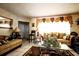 Cozy living room featuring tile floors, neutral tones, comfortable seating, and bright natural light at 11411 N 19Th St, Tampa, FL 33612