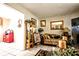 Charming living room featuring tile floors, neutral tones, comfortable seating, and decor at 11411 N 19Th St, Tampa, FL 33612